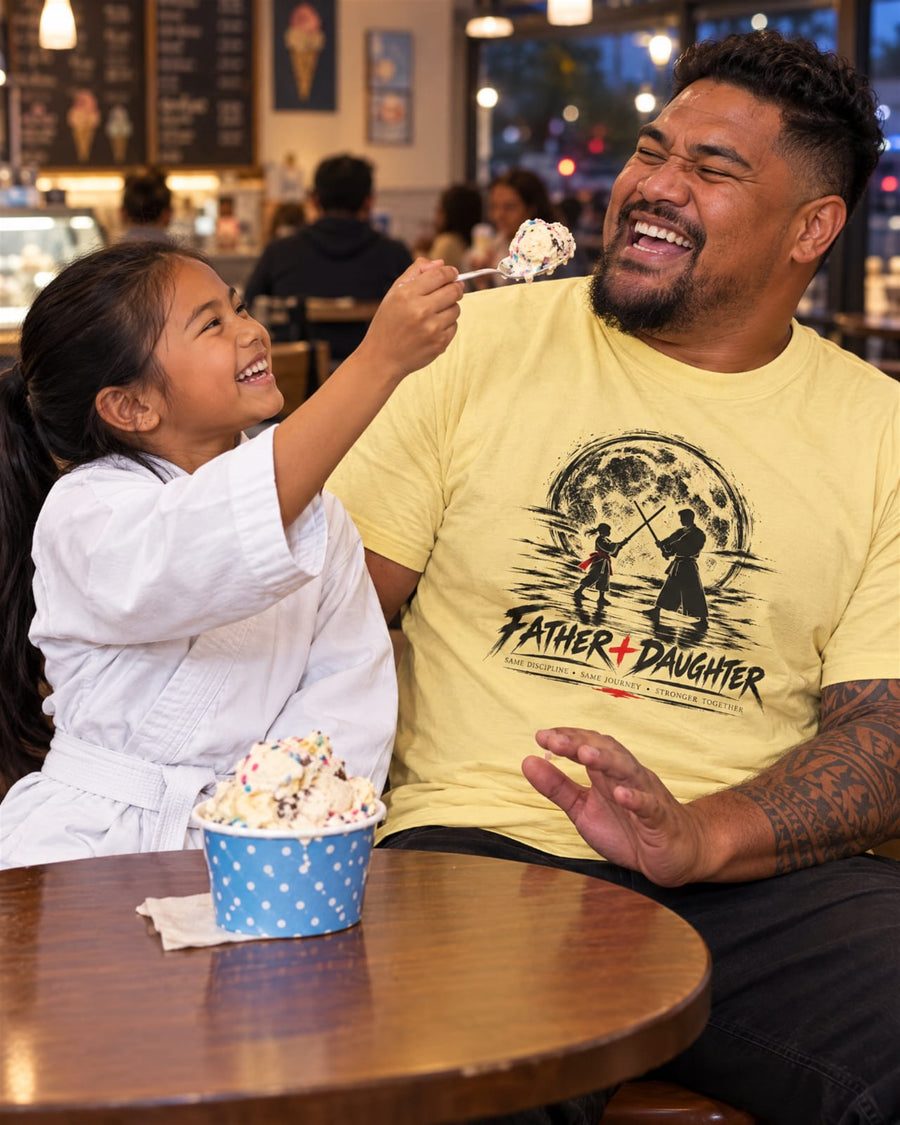 Father and daughter in a Moonlight tee
